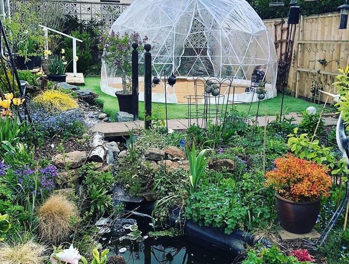 Igloo dome in a garden setting, daytime